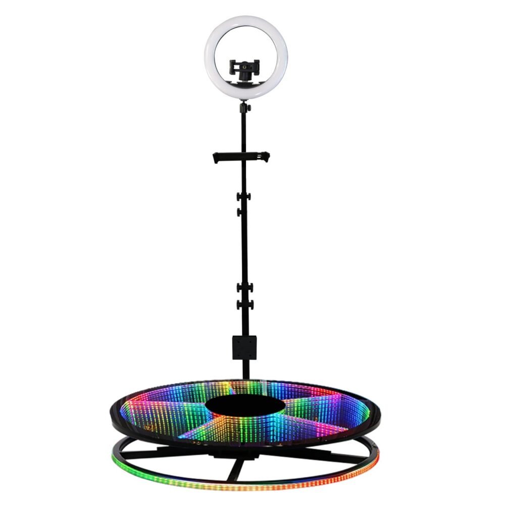 Showing you the Glass Photo Booth on white background with a lit platform what you get when you purchase a 360 Photo Booth