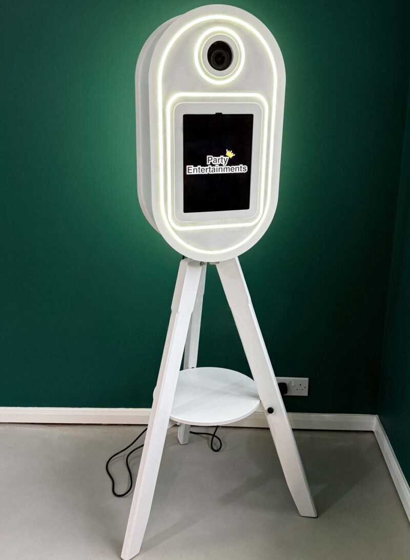 Vintage Pod Pro V3 white against a green wall showcasing our Vintage Photo Booths