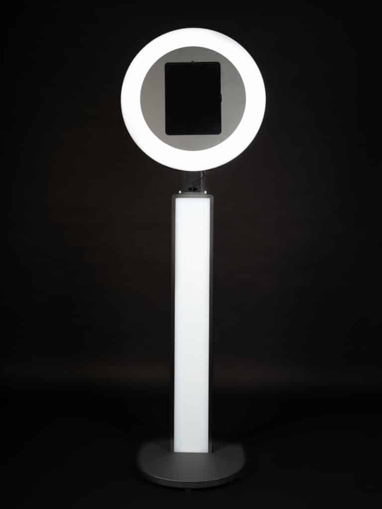 Black iPad Selfie Booth with advertising screen against a black background