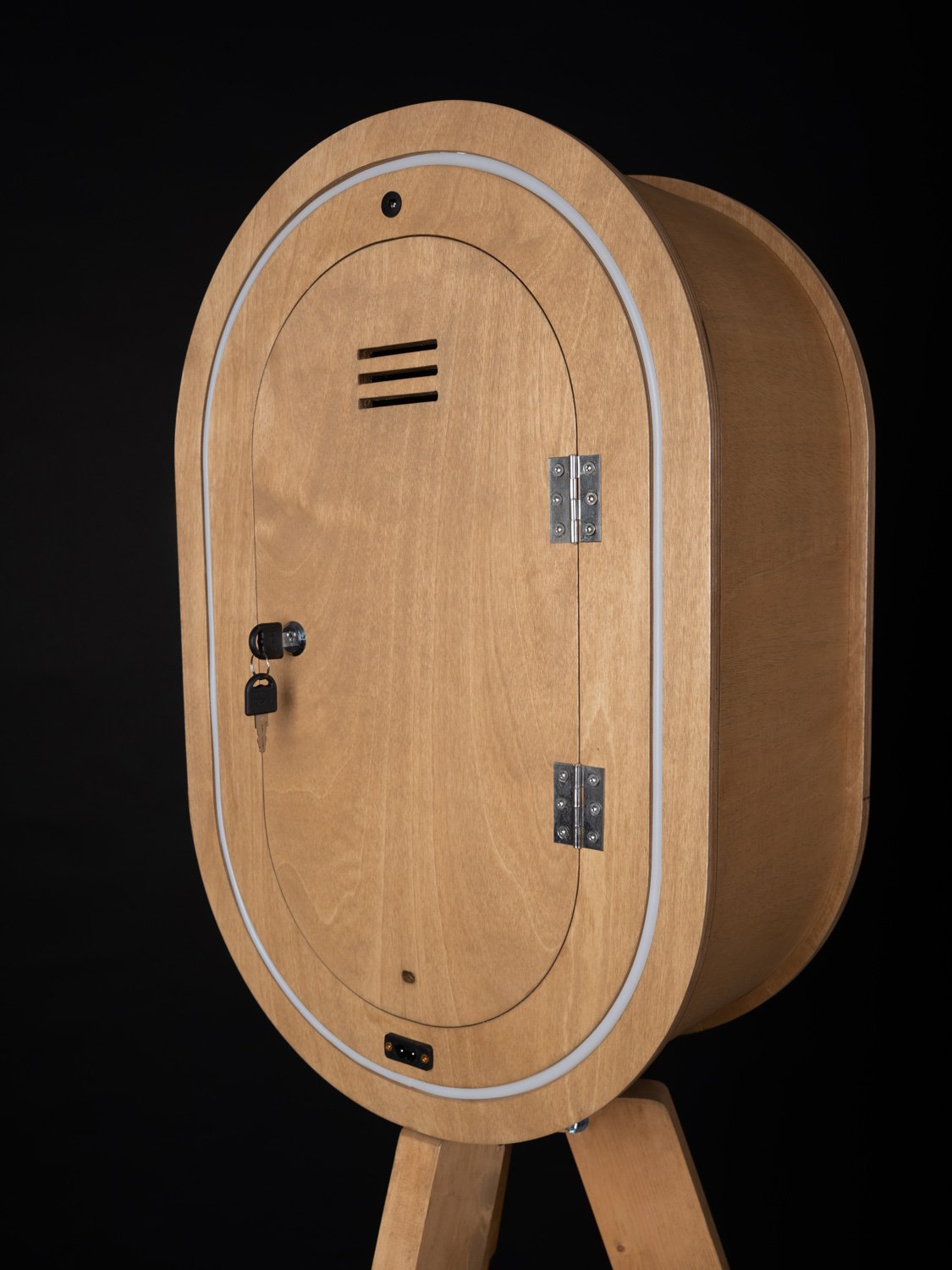 Close up of Oak Vintage Photo Booths on a black background