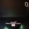 360 Photo Booths on a black background with a lit up green base