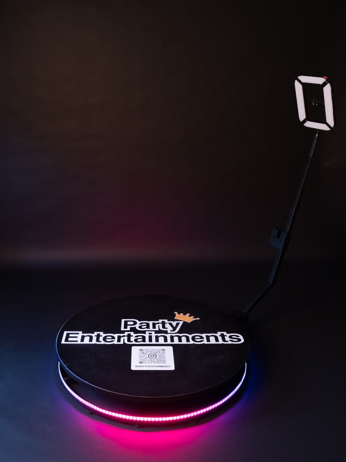 360 Photo Booths on a black background with a lit up pink base