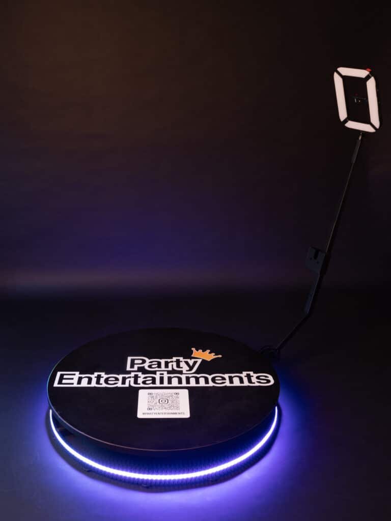 360 Photo Booths on a black background with a lit up Base