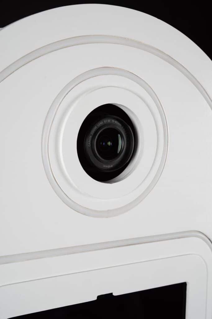Why Buy a Vintage Photo Booth: Timeless Charm with a Modern Twist 8 Close up of a white vintage photo booth showing the camera. Buy a Vintage Photo Booth from party entertainments today.