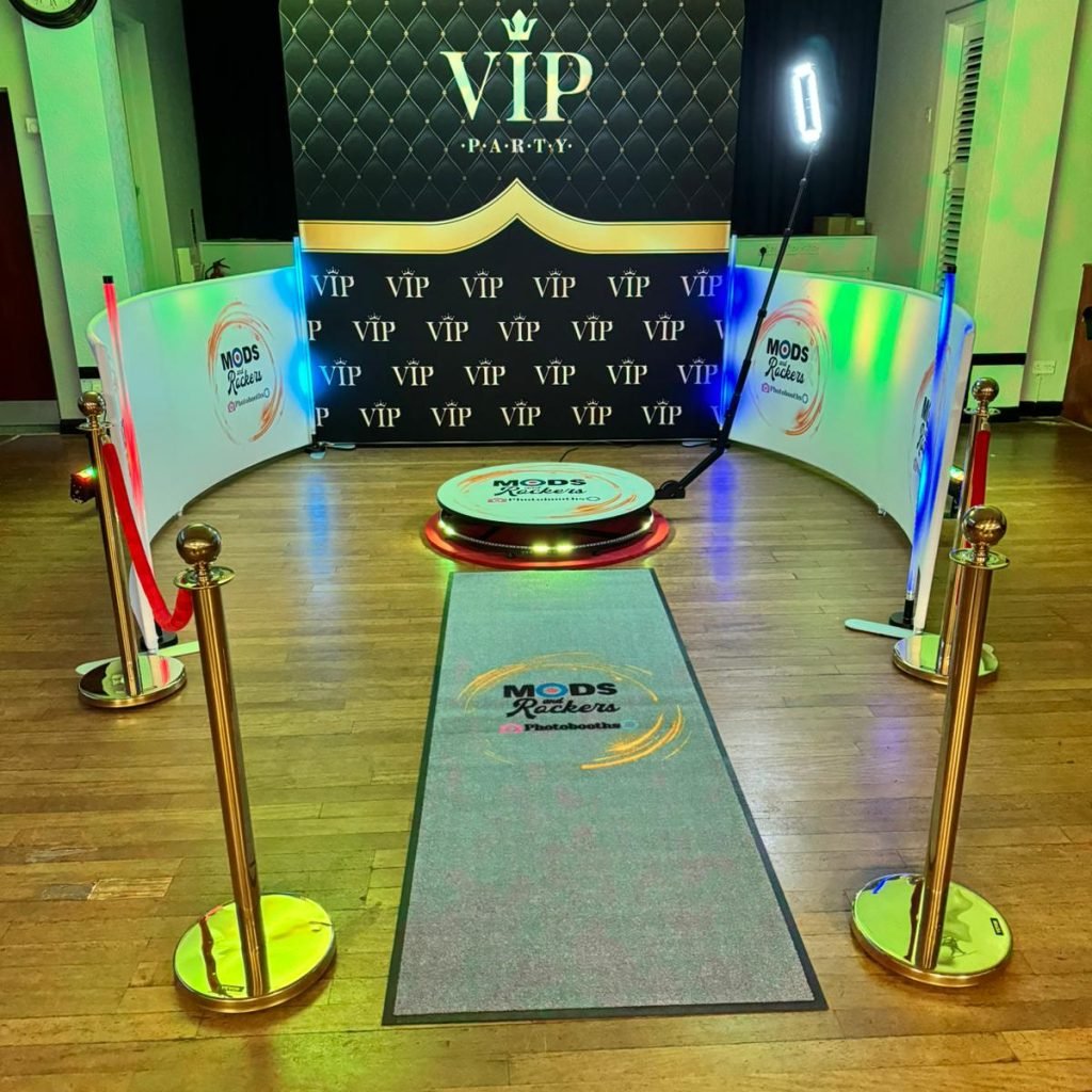 360 Photo Booth In a well lit room with back drop